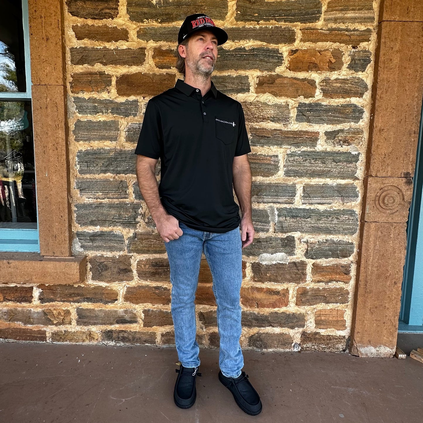 Raised by Coyotes | Bootstitch Pocket Polo | Black