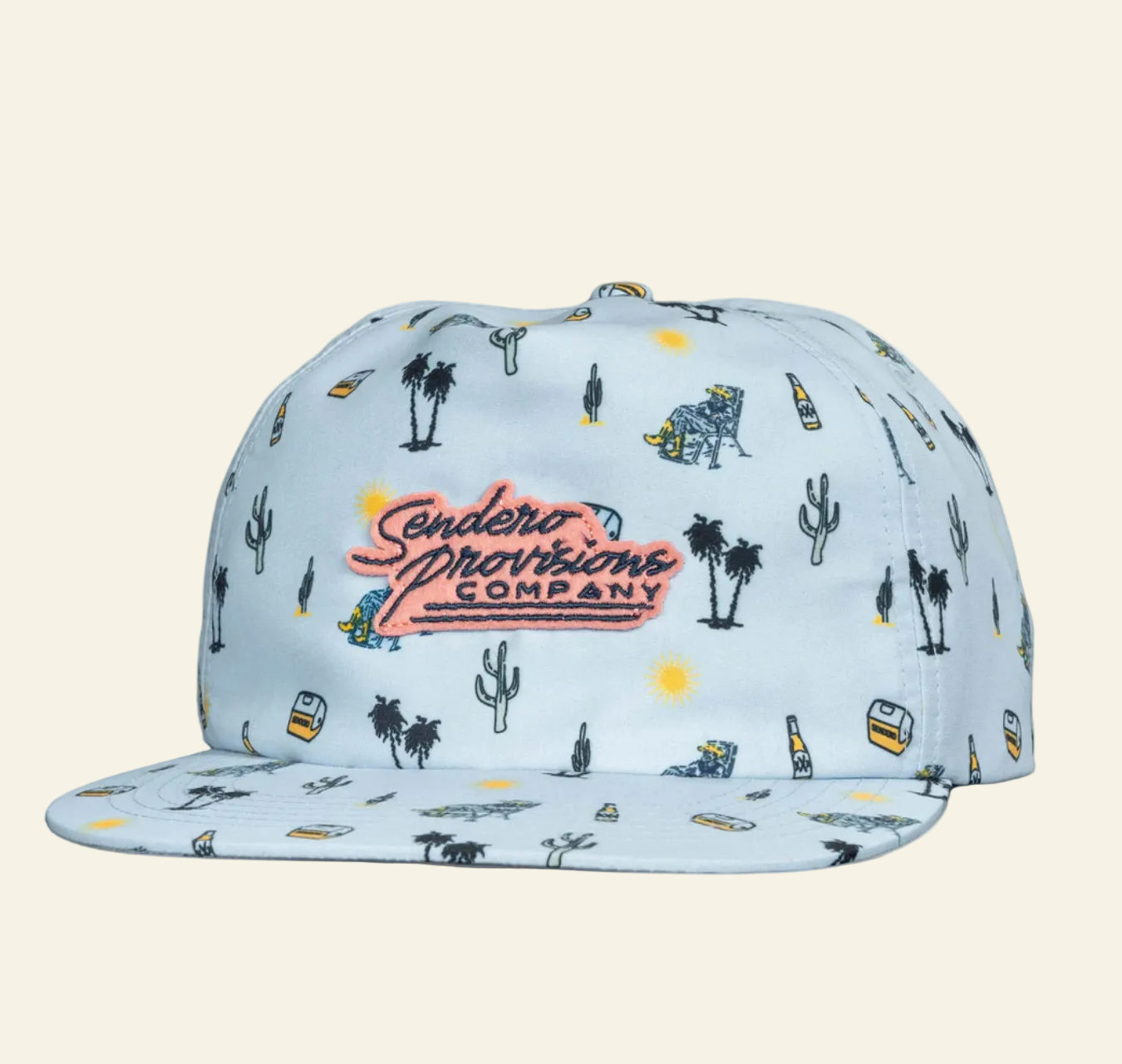 A blue baseball cap with patterned designs including what appears to be cacti, animals, and text related to the brand 'Sendero Provisions Co.'.