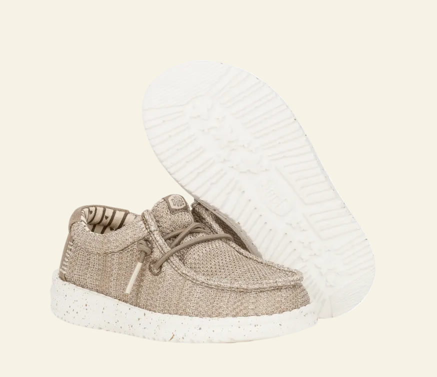 Brown baby shoe with white sole on a white background