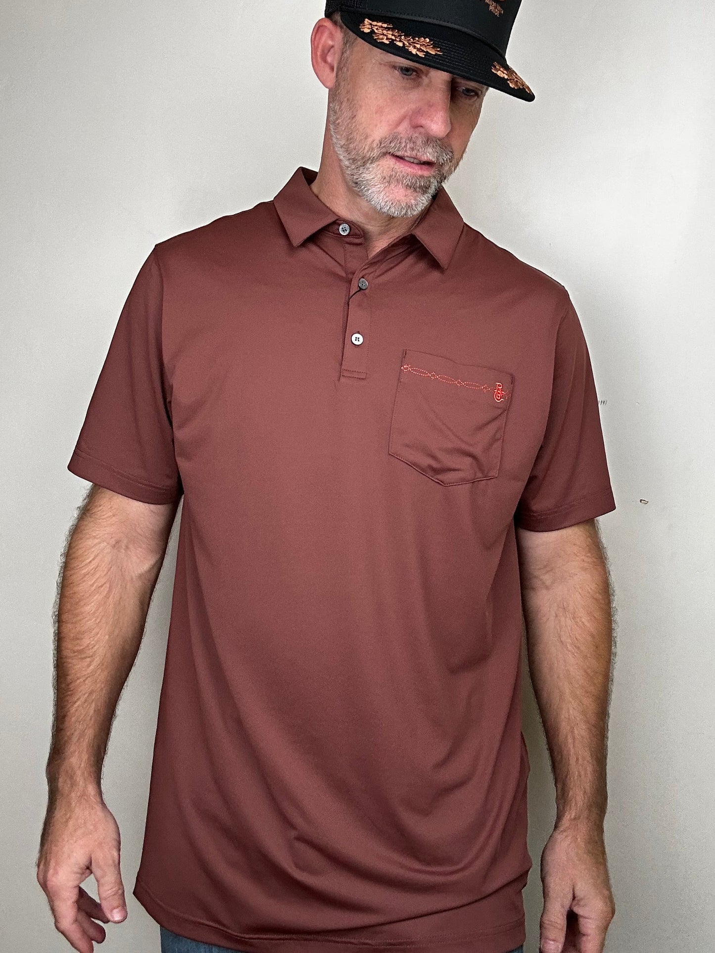 Raised by Coyotes | Bootstitch Pocket Polo| Texas Maroon