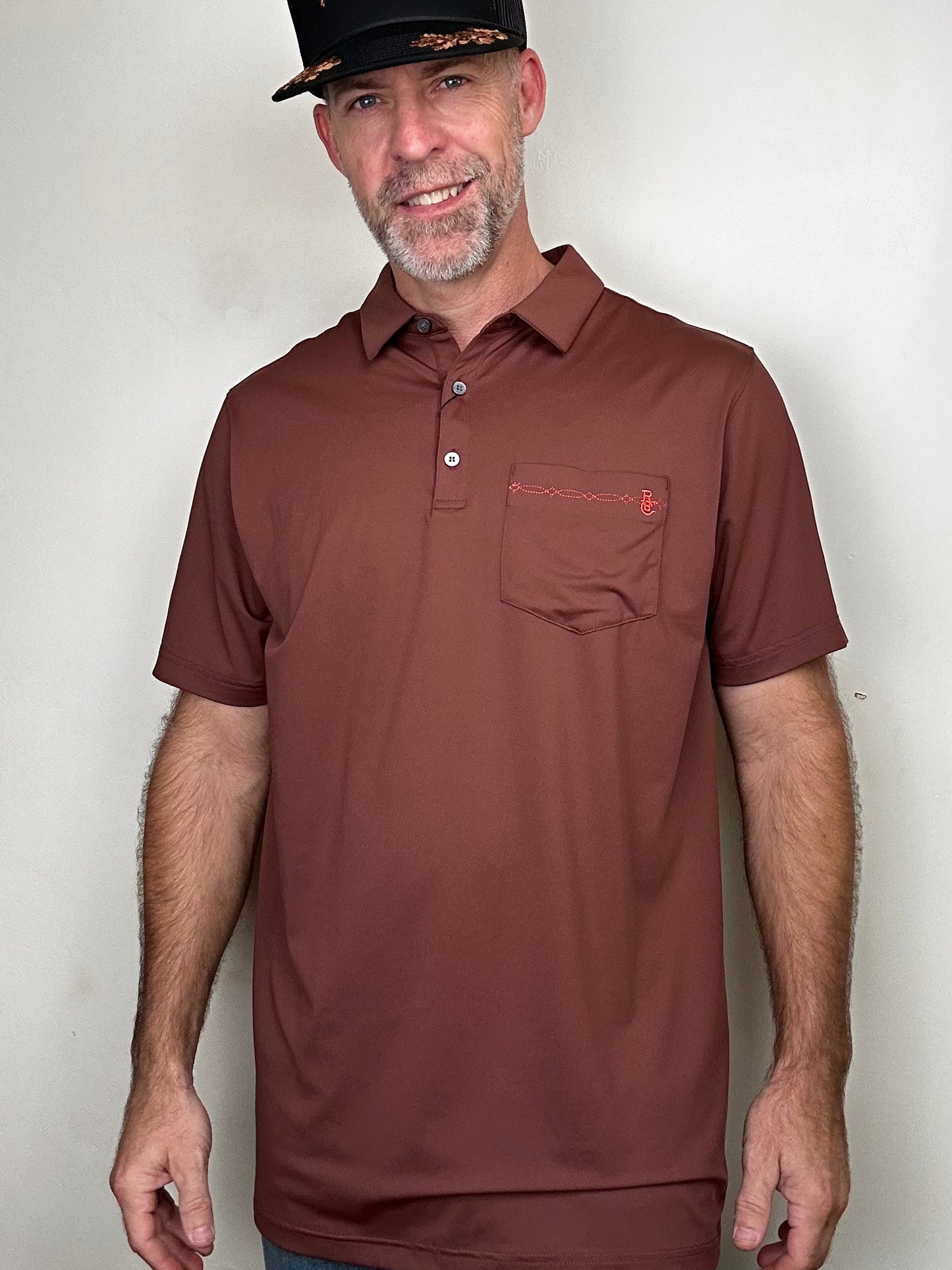 Raised by Coyotes | Bootstitch Pocket Polo| Texas Maroon