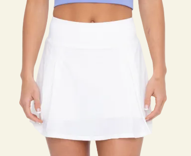 A white, solid-colored skort with a high waist and two pleats at the front.