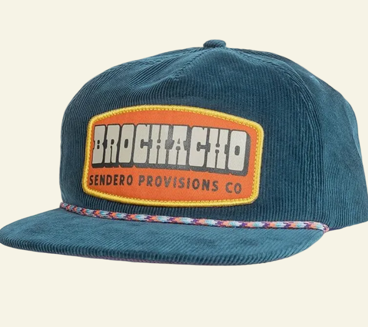 A green corduroy brochacho hat with an orange and white logo patch on the front and a multicolored strap.