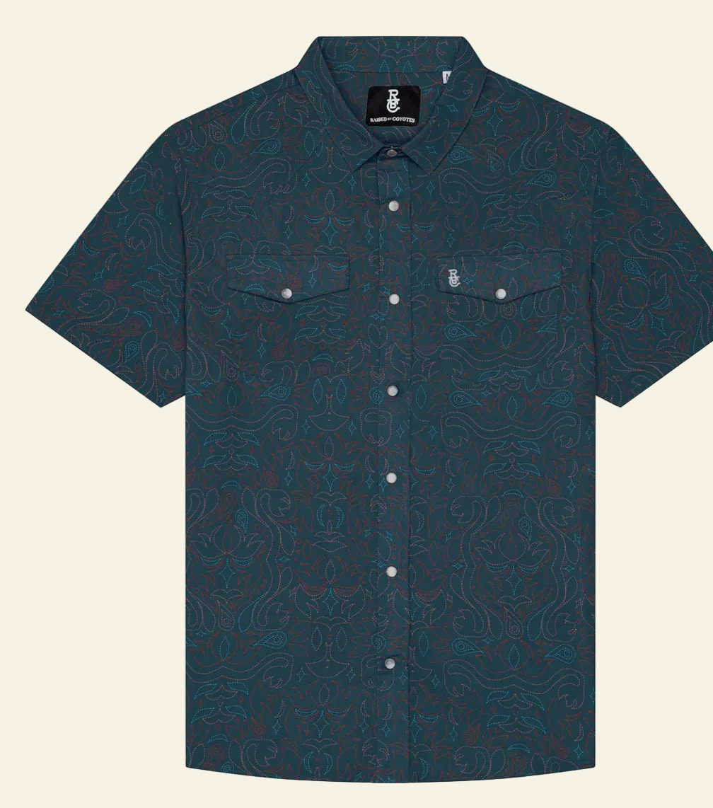A short-sleeved button-up shirt with a geometric boot stitch pattern in a dark color, featuring a chest pocket and a brand tag on the collar.