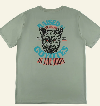 Green t-shirt with 'RAISED BY COYOTES' and 'IN THE HUNT' text and a coyote's head illustration above the text.