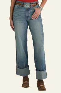 Person wearing blue jeans with a white background