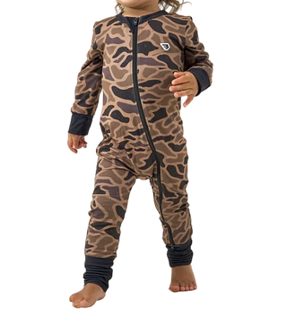 Child wearing a brown camouflage onesie with black accents on a white background