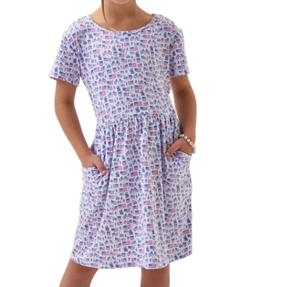 Girl wearing a flag and American theme patterned dress on a white background