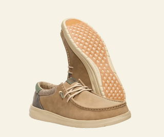 Tan casual shoe with a textured sole on a white background