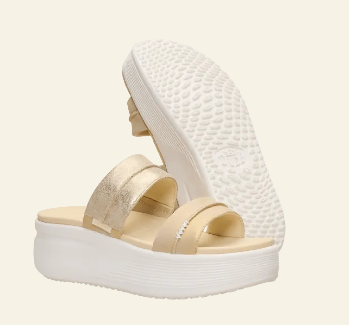 Beige sandals with white sole on a white background