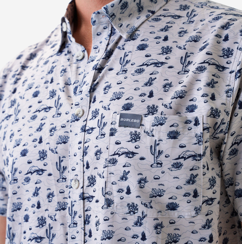 Close-up of a patterned shirt with a visible brand label.