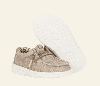 Brown baby shoe with white sole on a white background