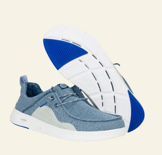 Hey Dude water shoes on cream background