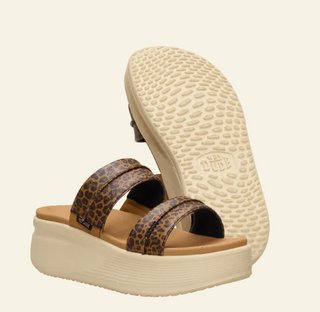 Platform sandal with leopard print straps on cream background