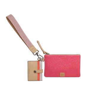 A pink glitter wristlet pouch with a matching pink wrist strap and a beige card holder tag featuring a vertical orange stripe, shown on a plain white background.