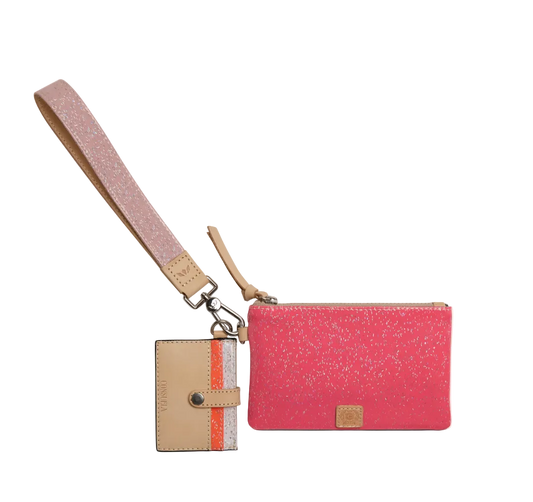 A pink glitter wristlet pouch with a matching pink wrist strap and a beige card holder tag featuring a vertical orange stripe, shown on a plain white background.