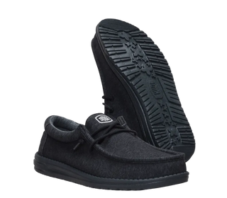 A pair of dark gray wool-blend slip-on shoes with black soles, one shown from the side and the other from the treaded bottom side, on a white background.