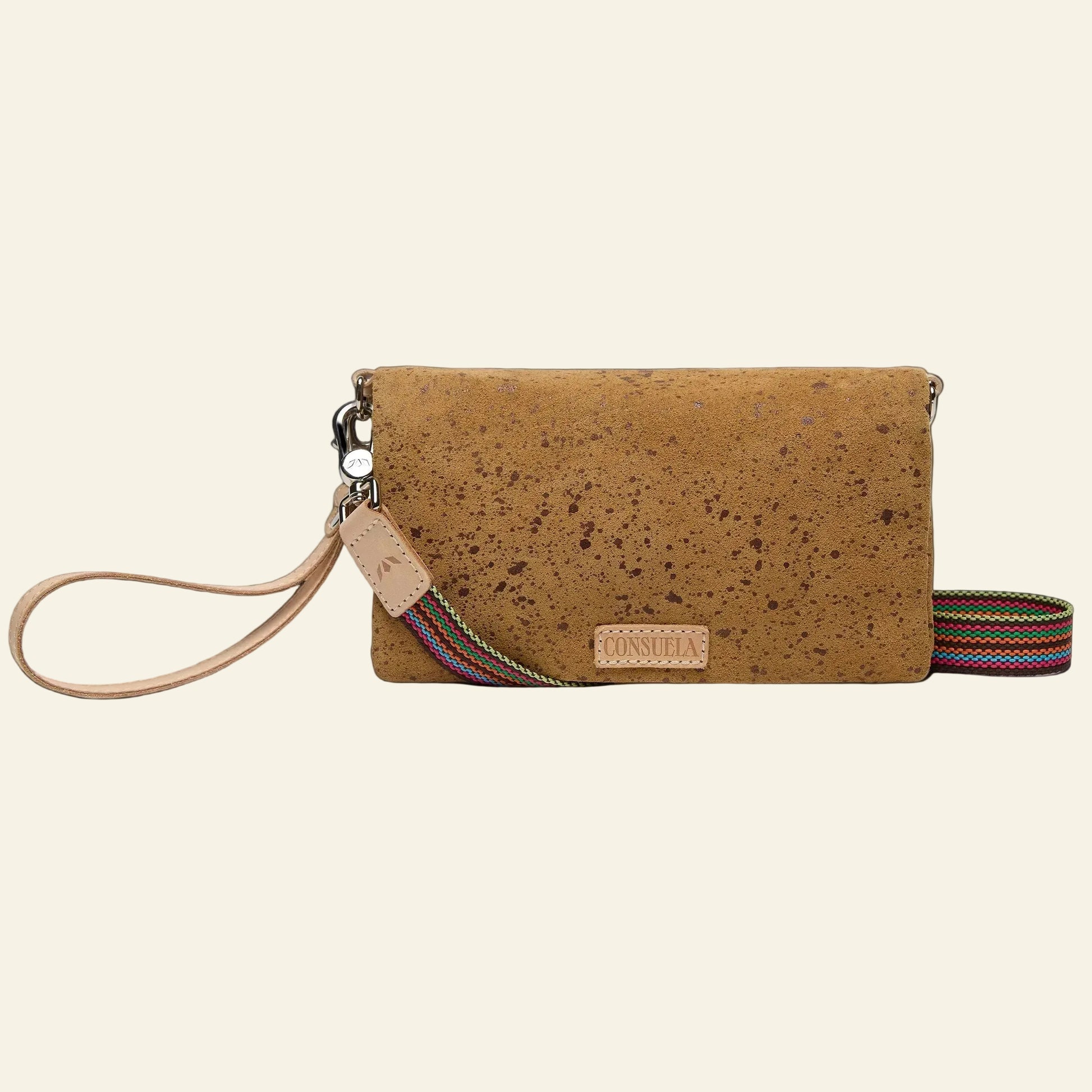 Brown cork / cider color handbag with a strap on a white background